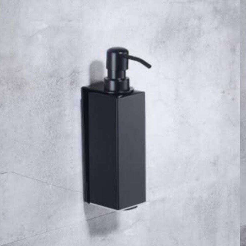 Press the wall-mounted soap dispenser